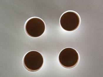 Directly above shot of tea cup against white background