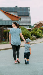 Full length of woman walking on road