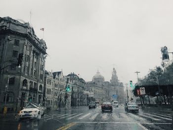 Traffic on road in city during rainy season