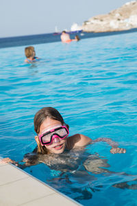 Portrait of girl swimming in pool