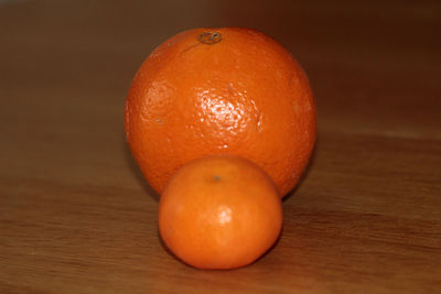 Close-up of orange apple on table