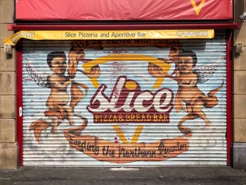 Graffiti on shutter of store