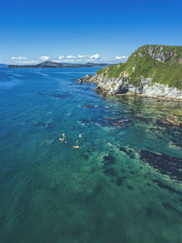 Scenic view of sea against blue sky