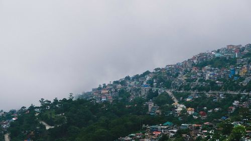 High angle view of buildings in city against sky