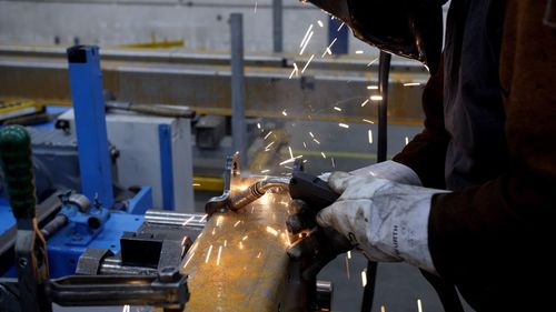 Low section of man working in factory