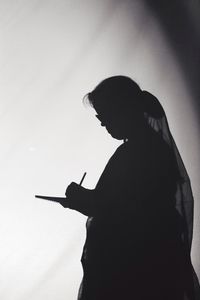 Close-up of woman against sky
