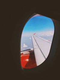 View of airplane seen through glass window