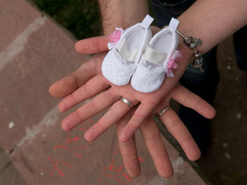 Close-up of hands holding baby booties