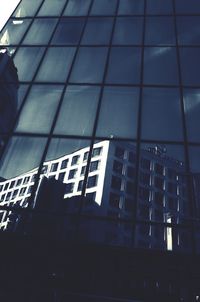 Low angle view of modern building against sky in city