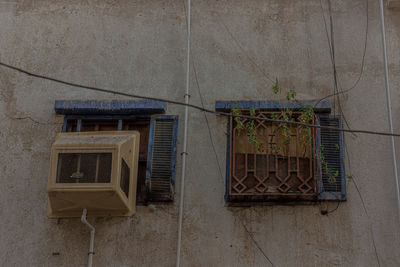 Low angle view of window on wall of building