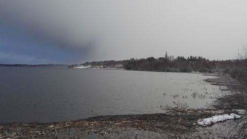 View of lake in city during winter