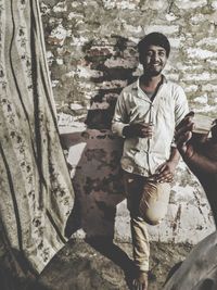 Portrait of young man standing outdoors