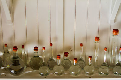 Close-up of glass bottles in row