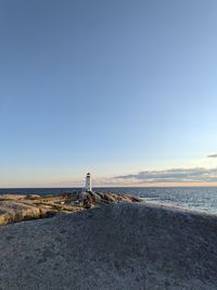 Scenic view of beach against clear sky