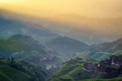 Scenic view of agricultural landscape against sky