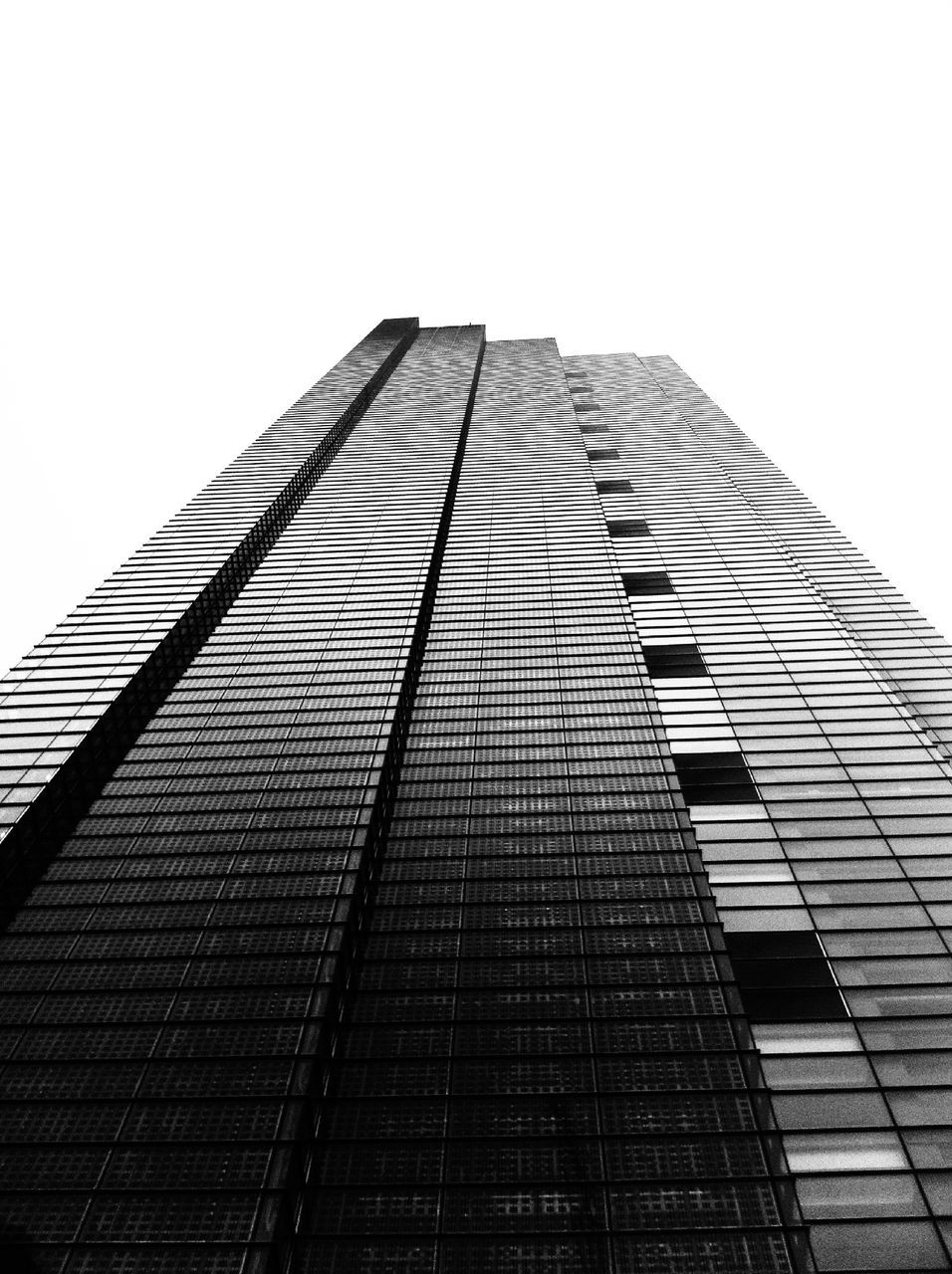 low angle view, architecture, building exterior, built structure, clear sky, tall - high, modern, tower, office building, skyscraper, building, city, tall, sky, day, glass - material, outdoors, no people, copy space, window