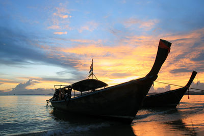 The scenic view on a sea with long boats from ao nang beach.