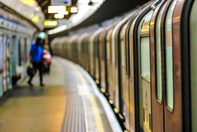 Blurred motion of train at railroad station