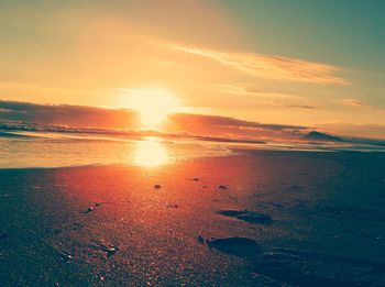 Scenic view of sea at sunset