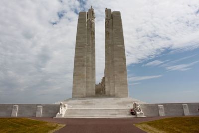 Low angle view of vimy monument against cloudy sky