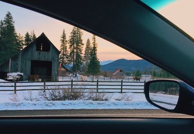 Buildings seen through car window during winter