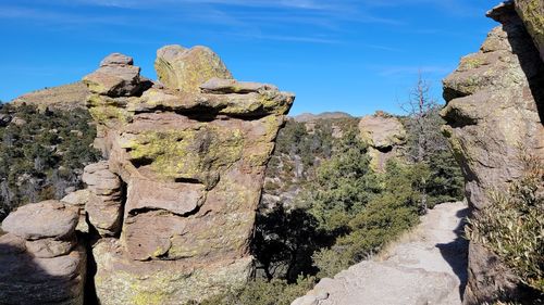 Low angle view of rock formation against sky