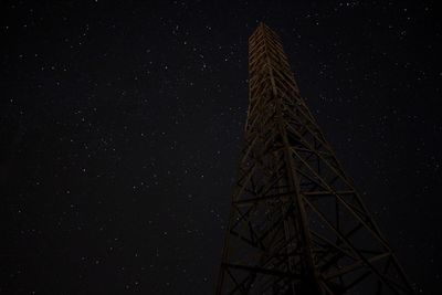 Low angle view of fireworks against sky at night