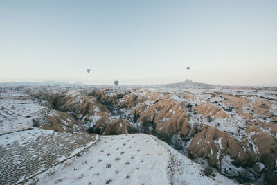 Scenic view of landscape against sky during winter