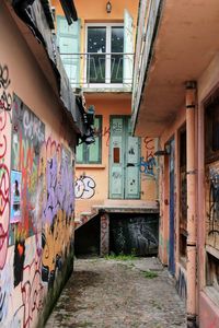 Empty alley amidst buildings