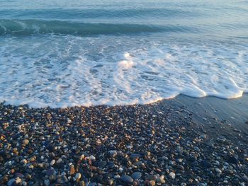 High angle view of pebbles at beach