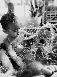 Cute baby girl in water
