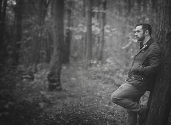 Woman standing in forest