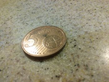 Close-up of coins on floor