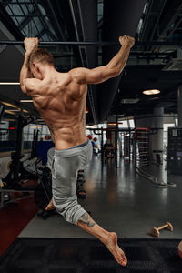 Low section of woman exercising in gym