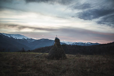 Scenic view of field against sky during sunset