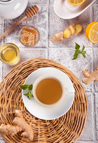 Refreshing ginger tea with lemon, mint leaf and honey