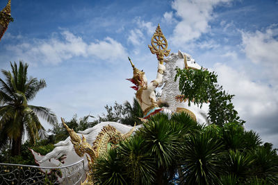 Statue of deity, god or goddess riding a horse at the wat chai chumphon chana songkhram temple