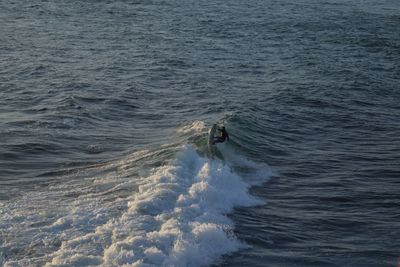 High angle view of man surfing in sea