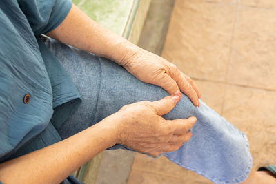 High angle view of man holding hands