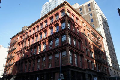 Low angle view of building against blue sky