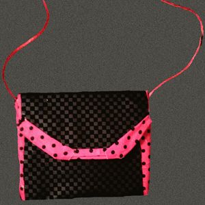 Directly above shot of pink hanging over black background