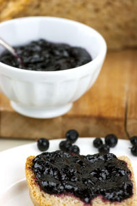 Black currant jam on slice of bread