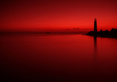 Scenic view of sea against romantic sky at sunset