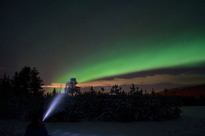 Scenic view of landscape against sky at night