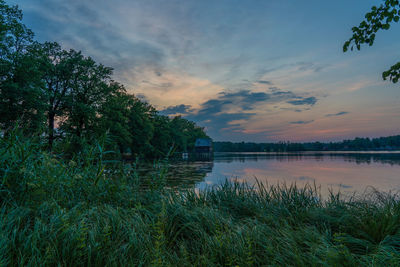 Scenic view of lake against sky during sunset