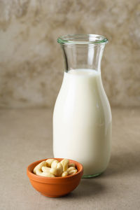 Close-up of drink in glass jar on table