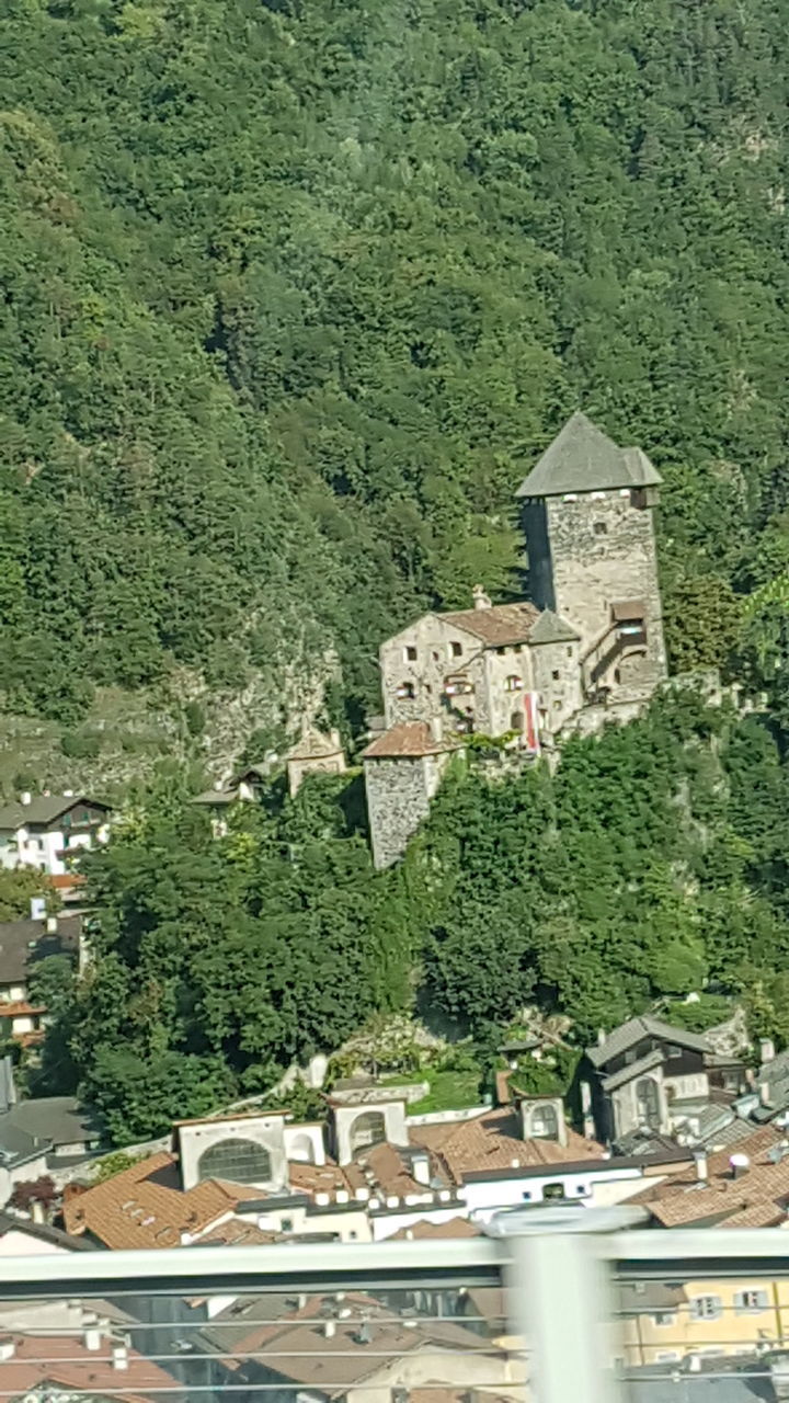 HIGH ANGLE VIEW OF HOUSES AND BUILDINGS IN CITY