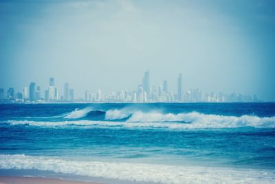 City skyline with sea in background