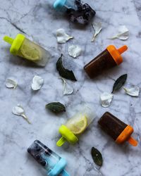 High angle view of popsicles on marble