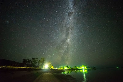 Scenic view of lake against star field at night